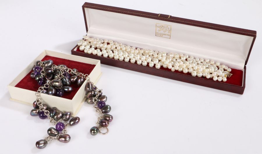 Set of simulated pearls together with an necklace