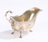 George V silver sauceboat, Birmingham 1935, makers mark rubbed, the acanthus leaf capped scroll