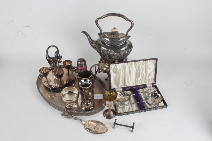 Silver plated wares to include tray, kettle and stand with burner, egg cruet, sugar castor, trophy