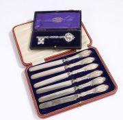 Set of six tea knives, with silver scroll decorated handles, housed in a fitted case, silver