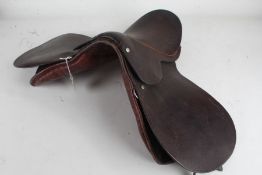 Brown leather horse riding saddle