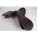 Brown leather horse riding saddle