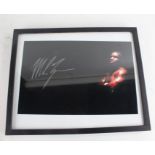 Mike Tyson, signed colour photograph, with COA and image of him signing, housed within a black and