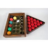 Set of Mid 20th Century snooker balls, consisting of cue ball, fifteen reds, yellow, green, brown,