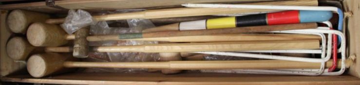 Croquet set, to include mallets and hoops, housed in a pine box