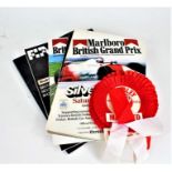 Collection of programmes, magazines and Manchester United ephemera to include, three rosettes for