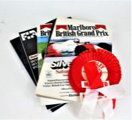 Collection of programmes, magazines and Manchester United ephemera to include, three rosettes for