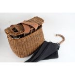 Wicker fishing basket and contents of seven various fishing reels to include Ambidex casting reel,