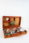 Collection of mostly Fly-Tying materials and some hooks, housed in a wooden box