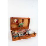 Collection of mostly Fly-Tying materials and some hooks, housed in a wooden box