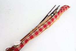 Three various spilt cane fishing rods, to include two three piece examples and a four piece example,