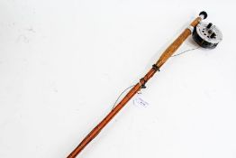 Two piece cane fishing rod with reel, (makers label missing)
