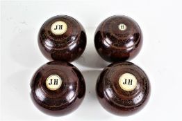 Taylor Rolph & Co., four lignum vitae lawn bowls, each with ivory discs, three initialled with an '