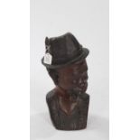 African carved wooden bust, in the form of a gentleman wearing a hat and smoking a pipe, 43cm high