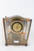 1960's/70's brass and glass clock, having shaped case and dial with Arabic numerals, 23.5cm high