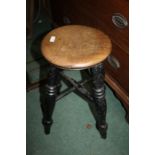 Elm seated stool, having circular seat above a black painted base (AF), 52cm high