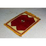 Persian Gabbeh rug, the central cream panel with a red medallion and small multi coloured lozenge,