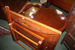 Edwardian mahogany butler's tray on stand, a walnut effect butler's tray on stand, and a mahogany