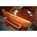 Edwardian mahogany butler's tray on stand, a walnut effect butler's tray on stand, and a mahogany