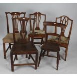 Three 19th century elm dining chairs, a mahogany similar, each with pierced slat back rests, and