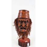 Chinese root wood mask, on a carved stand, 50cm high