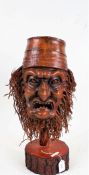 Chinese root wood mask, on a carved stand, 50cm high