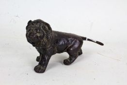 Bronze model of a lion, 17cm long