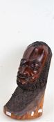 Yoruba carved darkwood male bust, with incised decorations, 43cm high