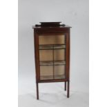 Edwardian display cabinet with a inlaid pediment above three shelves with glazed doors 119cm high