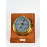 Sestrel brass cased marine barometer, the silvered dial inscribed "CAP'T O.M. WATTS LTD. LONDON", on