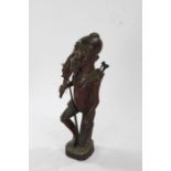 African carved wooden figure, in the form of a hunter, with animal draped over one shoulder and