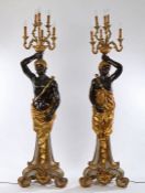 Pair of Venetian style Blackamoor candelabras, the standing male and female figures holding aloft