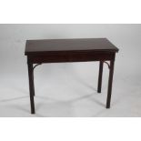 George III mahogany folding card table, the top opening to reveal a green lining, above chamfered