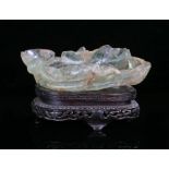 Chinese jade or hardstone brush washer, Qing Dynasty, carved in the form of a lotus leaf with raised
