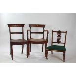 Two 19th century mahogany bar back dining chairs, to include a carver example, together with a