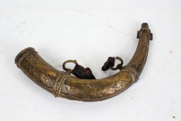 19th Century brass powder flask, of horn form, with scroll decoration, 29cm wide