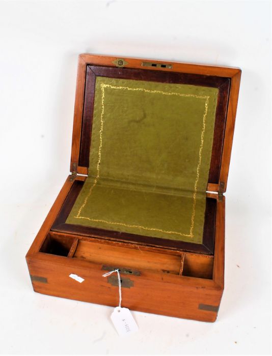 Victorian mahogany and brass bound writing box, the hinged lid with vacant cartouche, with green