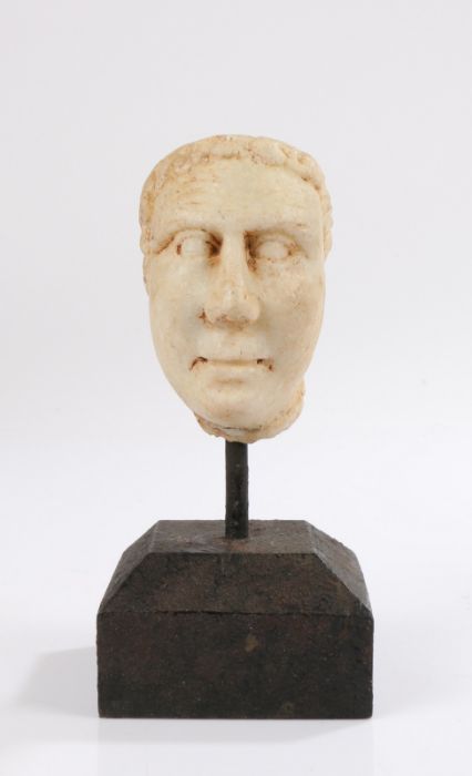 Grand Tour Roman style carved marble head of small proportions, with short curled hair, 8.5cm high