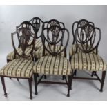 Set of four mahogany Sheraton style dining chairs, and three mahogany shield shaped dining chairs (