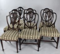 Set of four mahogany Sheraton style dining chairs, and three mahogany shield shaped dining chairs (