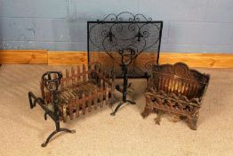 Two cast iron fire baskets, one in the gothic revival taste with a pair of dogs, and a wrought