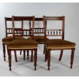 Set of four late Victorian dining chairs, with rail back and spindle back rests, raised on ring