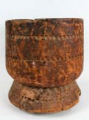Large African wooden mortar, the body with thumb moulded geometric decorations, 38cm high and 36cm