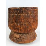 Large African wooden mortar, the body with thumb moulded geometric decorations, 38cm high and 36cm