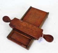 19th Century mahogany and brass mounted chemists pill roller, the body and handle stamped "NO.65",