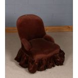 Victorian nursing chair, with brown upholstery and raised on turned legs and castors, 59cm wide