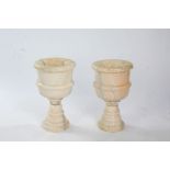 Pair of marble urns, in white marble turned into chalice form urns above detachable bases, 48cm high