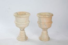 Pair of marble urns, in white marble turned into chalice form urns above detachable bases, 48cm high