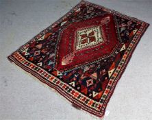 Persian Qashqai rug, the blue ground with two lozenges, decorated with deer or gazelle and further