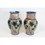 Upsala-Ekeby, pair of Swedish pottery vases, each of baluster form, painted with orange flowers of a